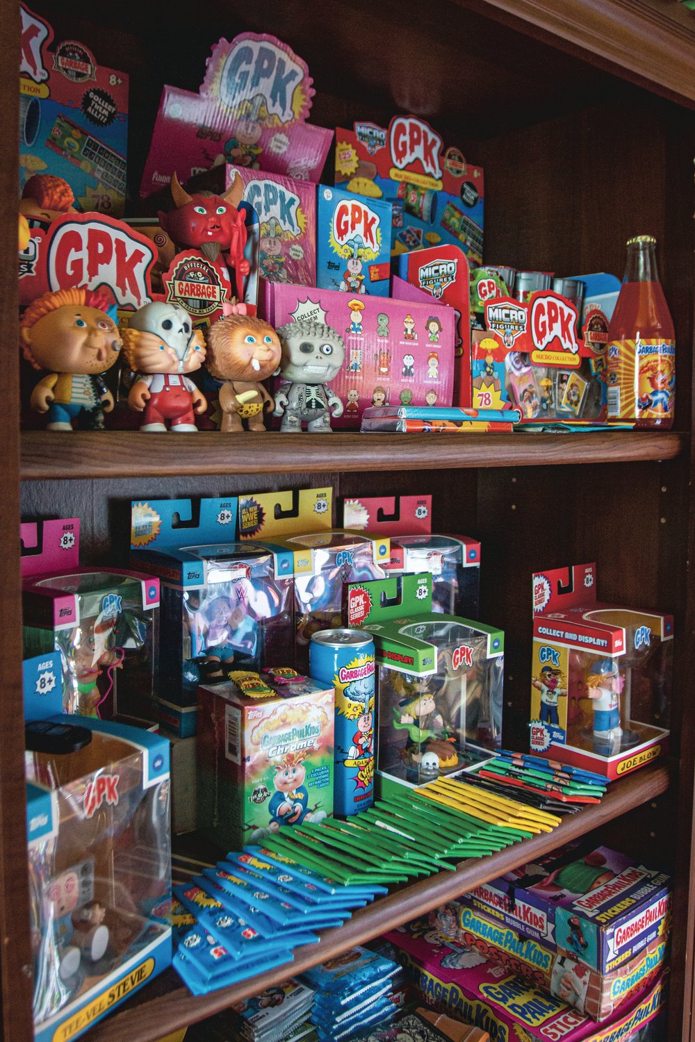 The Garbage Pail Kids fill an entire book shelf as part of Zane’s collection of vintage toys. This shelf has figurines, trading cards, stickers, candies and drinks — all part of the Garbage Pail Kids collection.